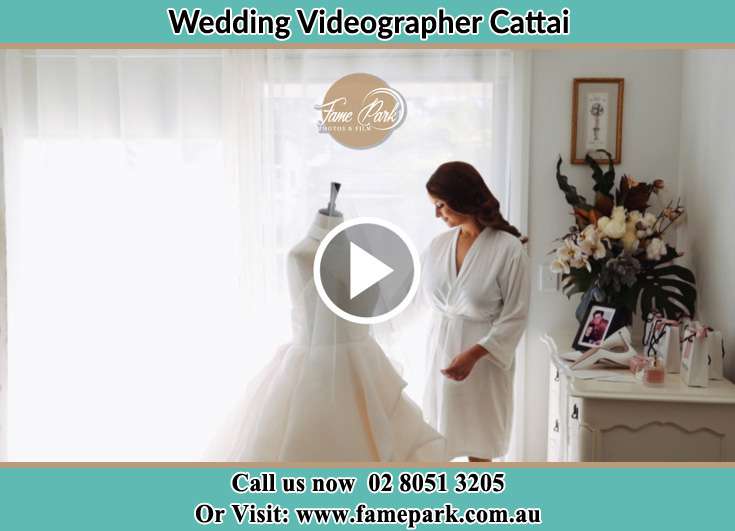 Bride looking at the wedding gown Cattai NSW 2765