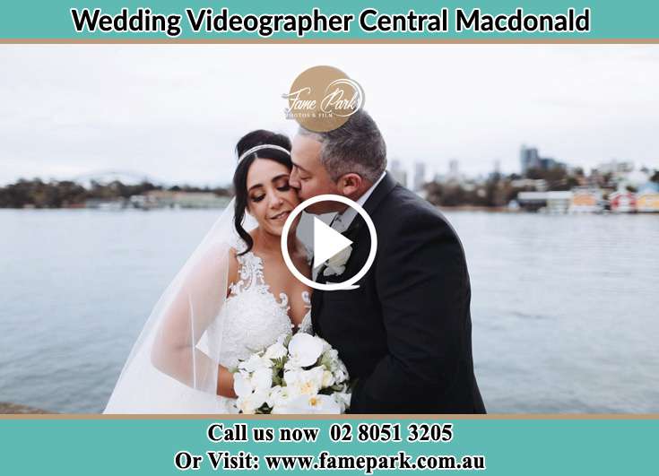 Bride and Groom kissed at the shore Central Macdonald NSW 2775