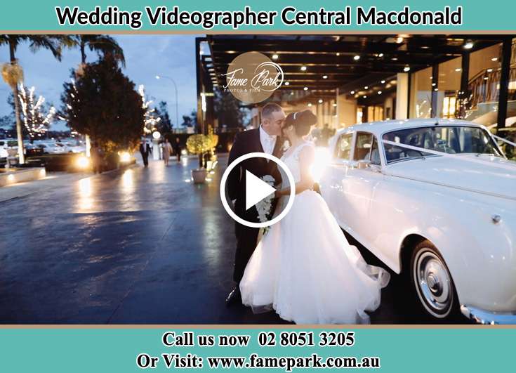 Bride and Groom kissed beside the bridal car Central Macdonald NSW 2775