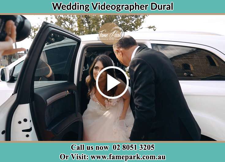 Bride getting out of the bridal car Dural NSW 2158